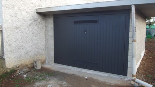 EDIFICAZIONE NUOVA AUTORIMESSA SOLARO - installazione basculante manuale