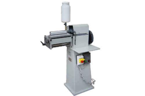  - Incollatrice a rulli colla base acqua.