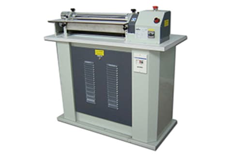  - Incollatrice a rulli per colle al lattice , all' acqua.