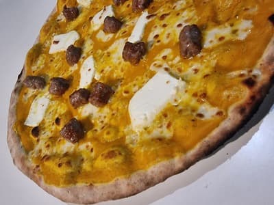 Figura illustrativa Kuuk Pizza